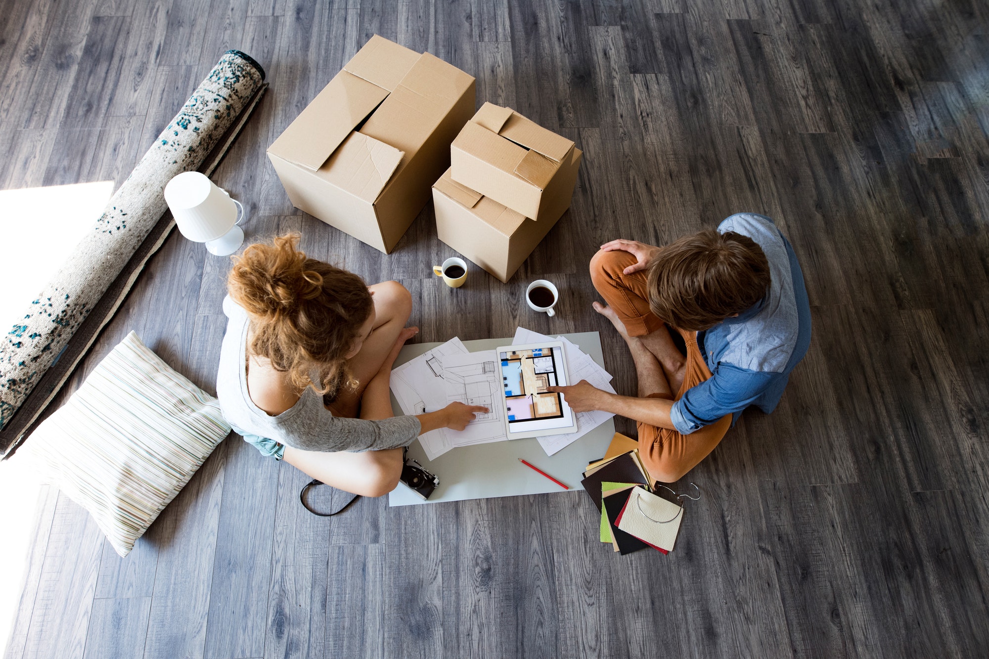 Young couple moving in new house.