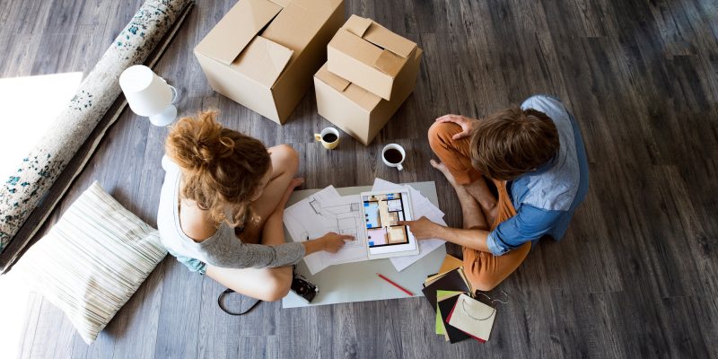 Young couple moving in new house.